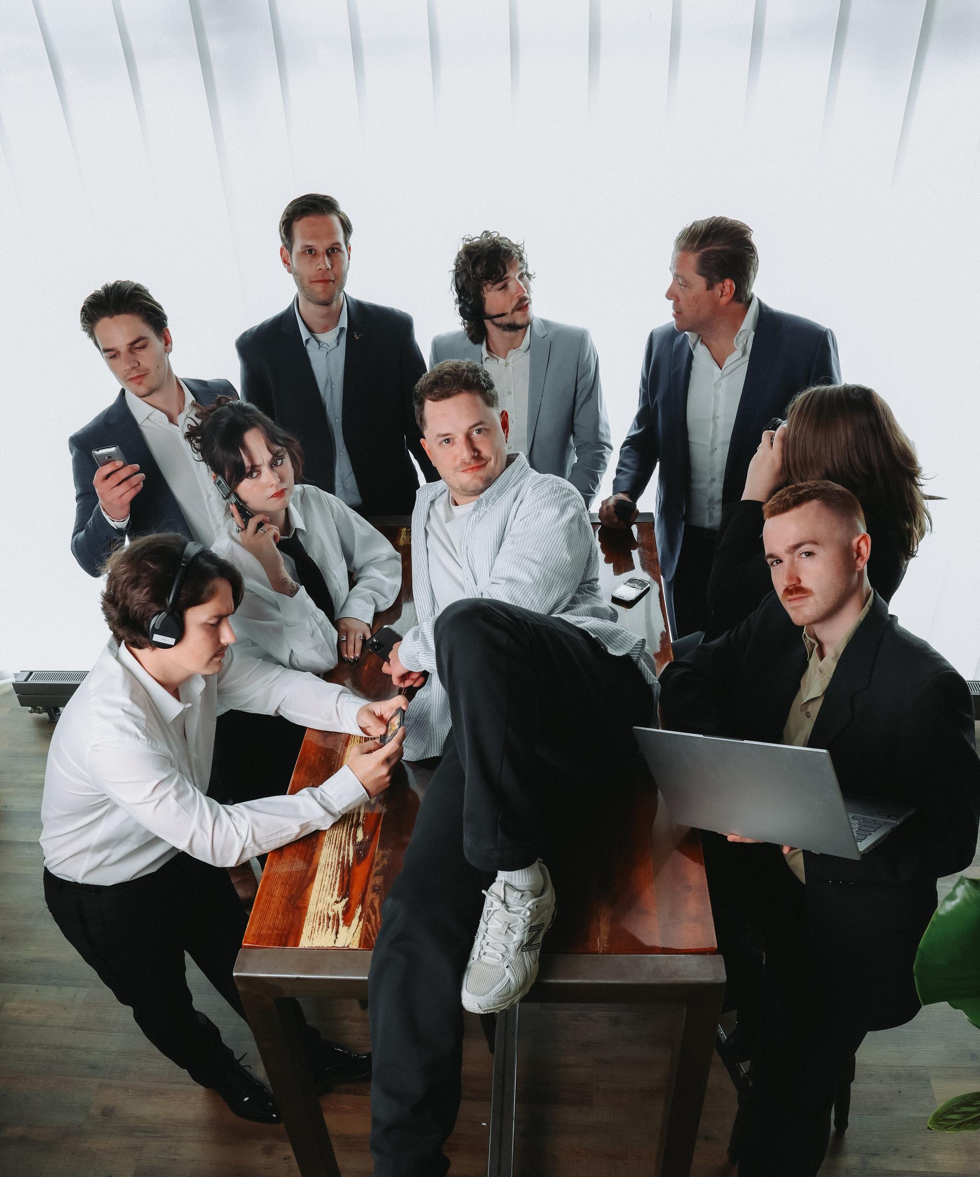 Group photo of the SocialFind team around the work table